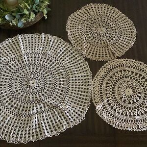 Bundle of three round crochet doilies in antique cream color